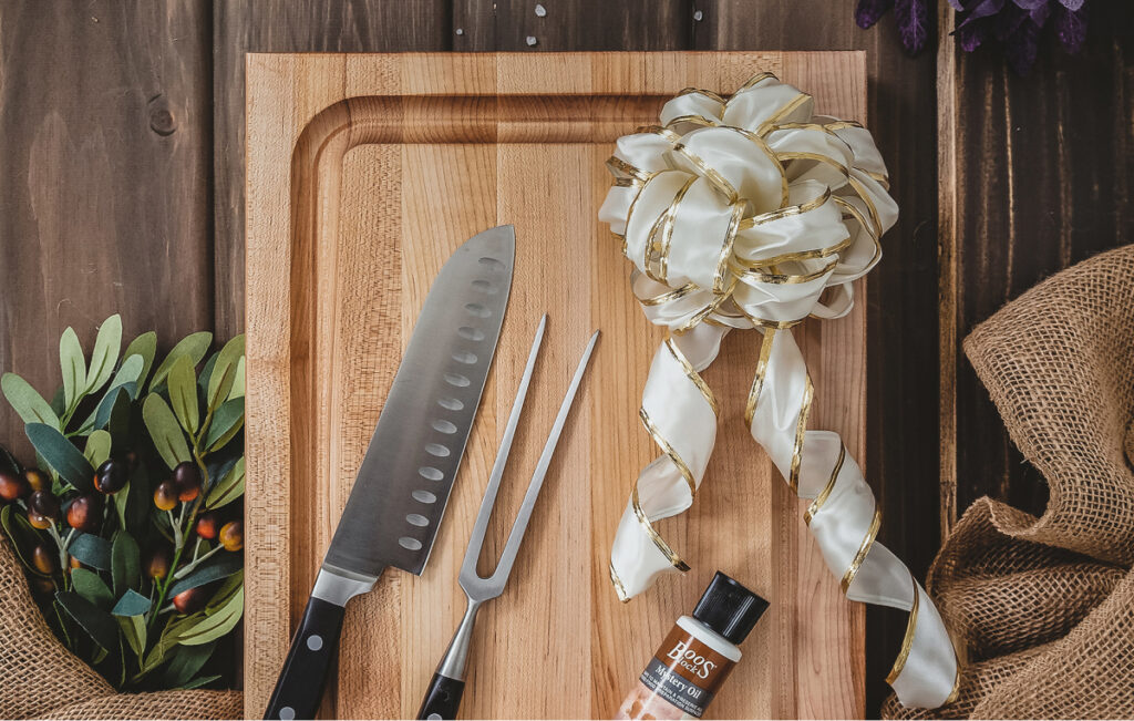Silk bow on Boos Block cutting board, mystery oil and chefs knife