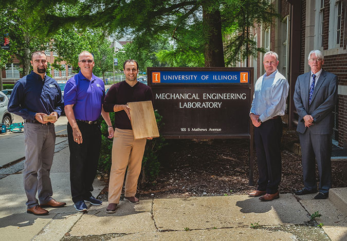 group standing in front of University of IL mechanical engineering laboratory